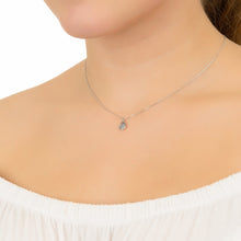 Woman Wearing Silver & Blue Topaz Teardrop Pendant Necklace Side View