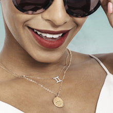 Woman Wearing Gemini Zodiac Necklace