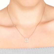Woman Wearing Gemini Zodiac Necklace