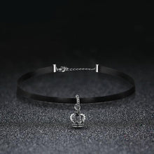 black choker necklace silver chain attachment crown pendant black background