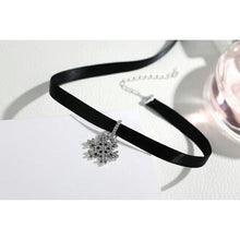 black choker necklace and back of 925 sterling silver snowflake pendant