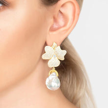 Woman Wearing Gold Baroque Pearl White Flower Drop Earrings