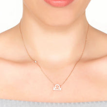 Woman Wearing Libra Zodiac Necklace