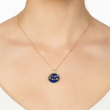 Woman Wearing Gemini Gold and Lapis Lazuli Pendant Necklace