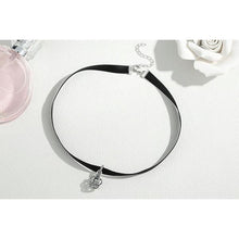 black choker necklace with 925 sterling silver royal crown pendant beside perfume
