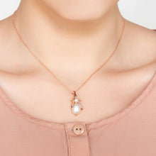 Woman Wearing Pearl Gemstone Bee Pendant Necklace