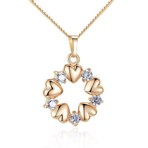 gold plated necklace and circular pendant with hearts and cubic zirconia gemstones