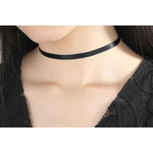 woman wearing black choker necklace with silver chain attachment