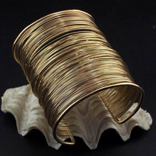 Wraparound Coil Arm Cuff on Oyster Shell